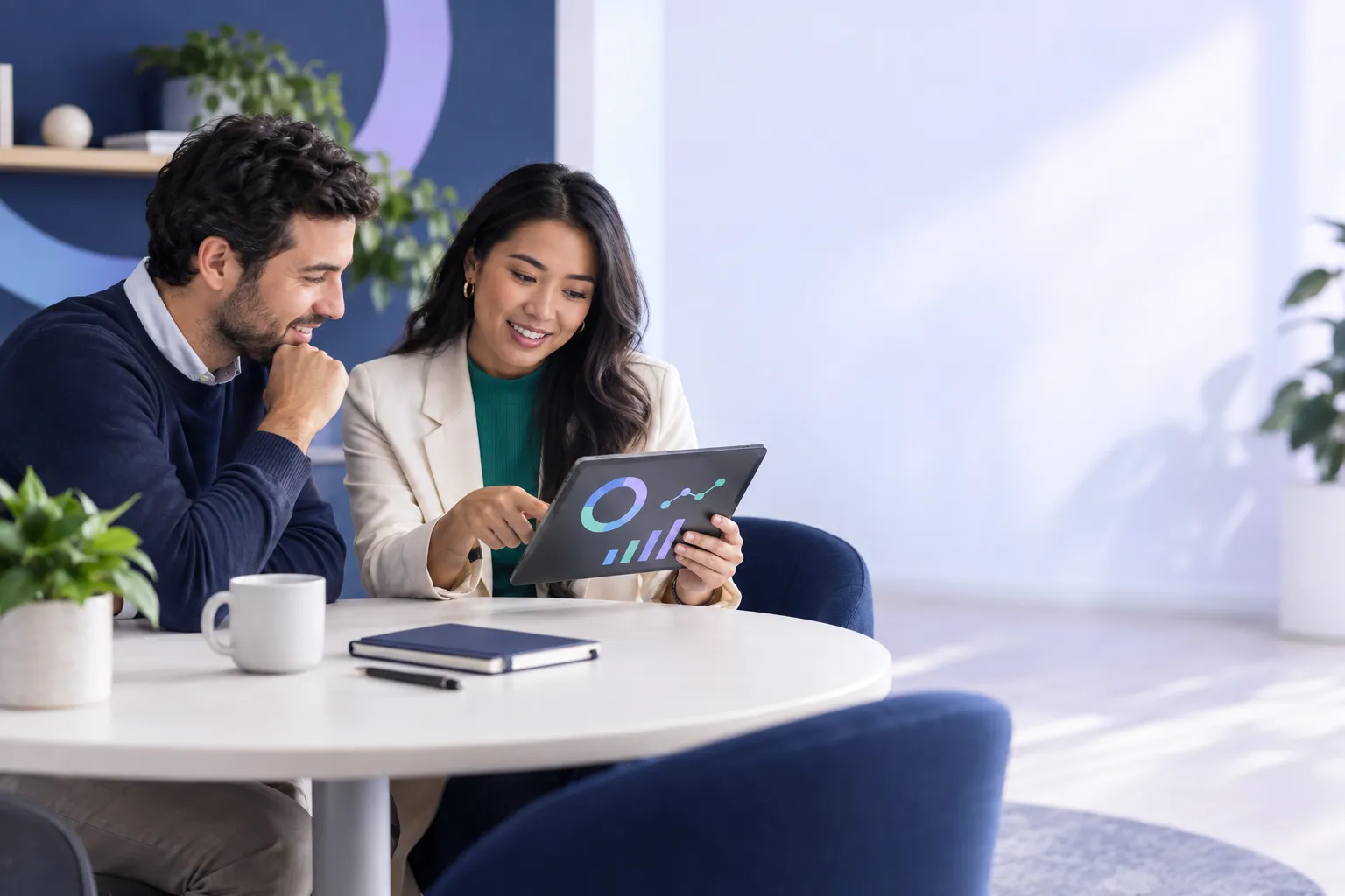 Modern office desk with financial charts comparing two hiring cost options