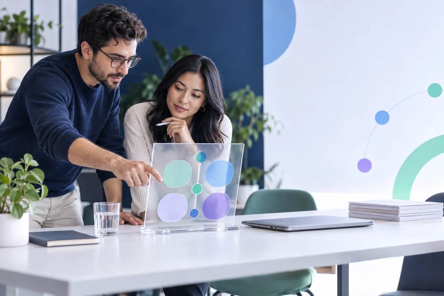 Clean editorial visual of a startup founder reviewing financial strategy dashboard with growth charts